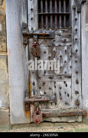 Old door of a prisoners' cell originally within the county gaol of 1694 rebuilt in 1695 remaining in use till 1861, Warwick, UK Stock Photo