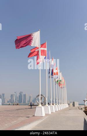 Flags of nations qualified for World Cup Qatar 2022 hoisted at Doha Corniche, Qatar. Stock Photo