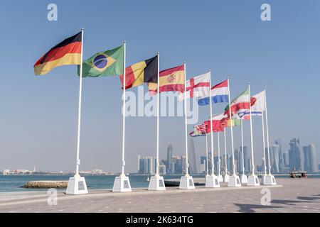 Flags of nations qualified for World Cup Qatar 2022 hoisted at Doha Corniche, Qatar. Stock Photo