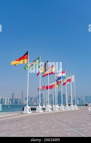 Flags of nations qualified for World Cup Qatar 2022 hoisted at Doha Corniche, Qatar. Stock Photo