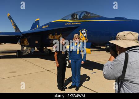 Photographer photographs Lt. Kaitlin Forster (R) with AME1 Nathaly Jarrett during a media event aboard MCAS Miramar in San Diego, California Stock Photo