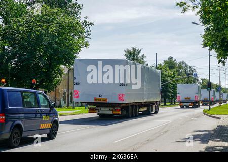 Transportation of oversized cargo on public roads with an accompanying escort car Stock Photo