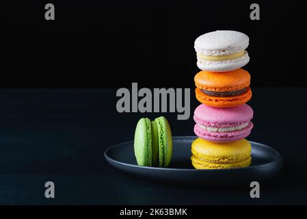 Colorful macarons cakes. Small French cakes. Sweet and colorful french macaroons Stock Photo