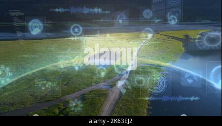 Composition of data processing with scope scanning and globe over landscape Stock Photo