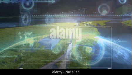 Composition of data processing with scope scanning and globe over landscape Stock Photo