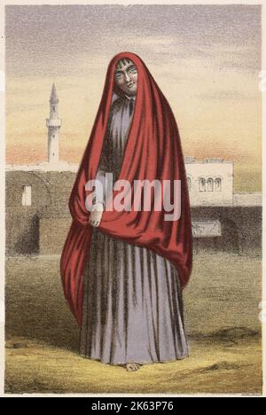 Bedouin woman in a red cloak Stock Photo