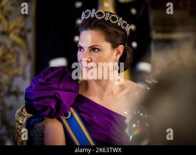 2022-10-11 21:47:51 STOCKHOLM - Crown Princess Victoria at the state banquet at the royal palace during a three-day state visit from the Netherlands to Sweden. During the state banquet, both heads of state gave speeches. ANP POOL REMKO DE WAAL netherlands out - belgium out Stock Photo