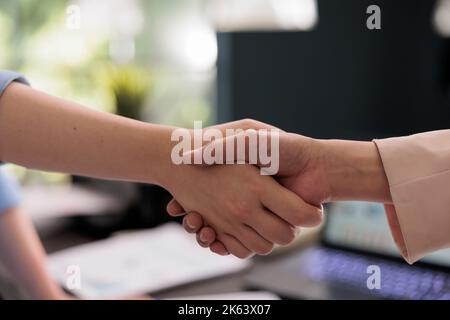 Business partners agreement, handshake, close view on hands, company workers cooperation, successful, investment deal. Coworkers collaboration, colleagues meeting, partnership concept Stock Photo