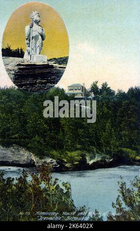 Admiralty House (once the site of a grand home for admirals in the British Royal Navy) and the wooden figurehead of the old HMS Irresistible which stood on the dock - Bermuda. Stock Photo