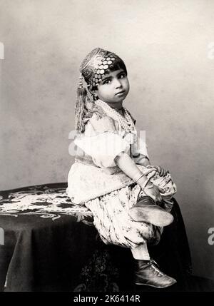 19th century vintage photograph: Cute child, in photographer's studio, probably India, late 19th century Stock Photo