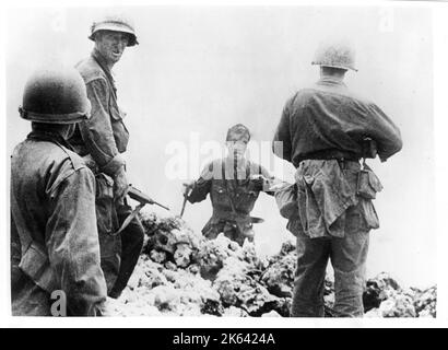 Vintage photograph World War II - Japanese navy officer surrenders to American soldiers on Okinawa Stock Photo