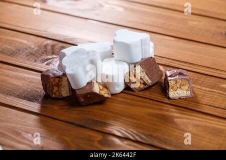 chocolate with nuts on a wooden board with marshmallows Stock Photo