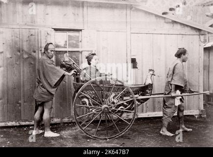 c.1870's Japan -  woman in a rickshaw - from 'The Far East' magazine Stock Photo