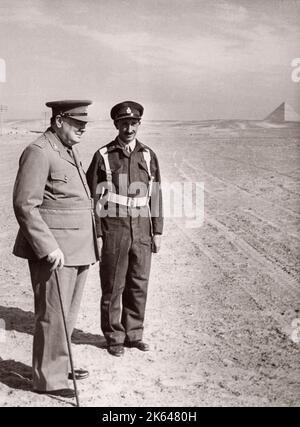 1943 Egypt - British prime minister Winston Churchill reviewing troops of the 4th Queen's Own Hussars on December 3rd Photograph by a British army recruitment officer stationed in East Africa and the Middle East during World War II Stock Photo