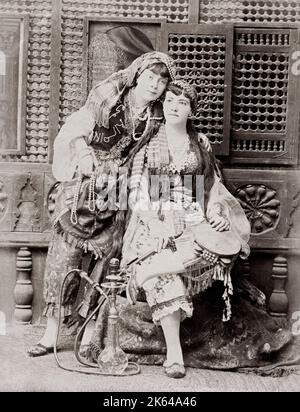 Two young Egyptian woman with hookah pipe, Egypt, c.1880's Stock Photo