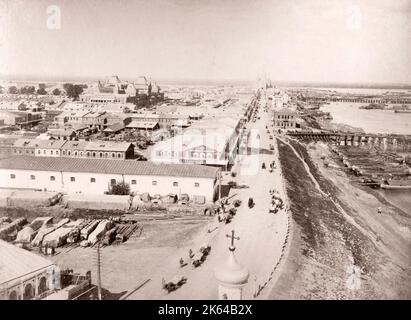 19th century vintage photograph Russia - Nizhny Novgorod Fair (old name Ã¢Â€Â” Makaryev Fair) (Russian: ÃÂÃÂ¸ÃÂ¶ÃÂµÃÂ³ÃÂ¾Ã‘Â€ÃÂ¾ÃÂ´Ã‘ÂÃÂºÃÂ°Ã‘Â Ã‘ÂÃ‘Â€ÃÂ¼ÃÂ°Ã‘Â€ÃÂºÃÂ°) was a fair in Nizhny Novgorod held annually every July near Makaryev Monastery on the left bank of the Volga River from the mid-16th century to 1816. Following a massive fire in 1816, it was moved to Nizhny Novgorod, but for some decades thereafter it still was commonly referred to as Makaryev Fair. It attracted many foreign merchants from India, Iran, and Central Asia. Stock Photo