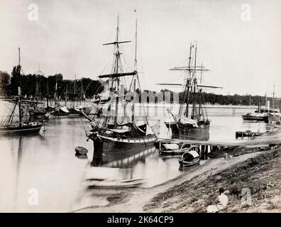 Vintage 19th century photograph - ships tied up along the river, Seville, Spain Stock Photo