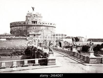 19th century vintage photograph: The Mausoleum of Hadrian, usually known as Castel Sant'Angelo, is a towering cylindrical building in Parco Adriano, Rome, Italy. It was initially commissioned by the Roman Emperor Hadrian as a mausoleum for himself and his family. Viewed from across the River Tiber, c.1880's. Stock Photo