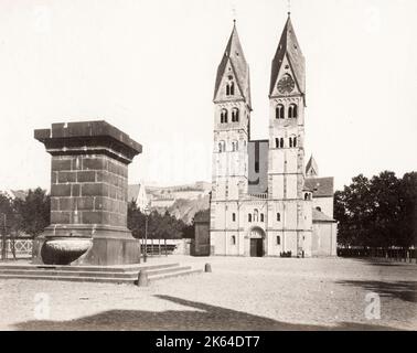 Vintage 19th century photograph: Germany - The Basilica of St. Castor is the oldest church in Koblenz in the German state of Rhineland Palatinate. It is located near Deutsches Eck at the confluence of the Rhine and the Moselle. A fountain called Kastorbrunnen was built in front of the basilica during NapoleonÃ¢Â€Â™s invasion of Russia in 1812. Stock Photo