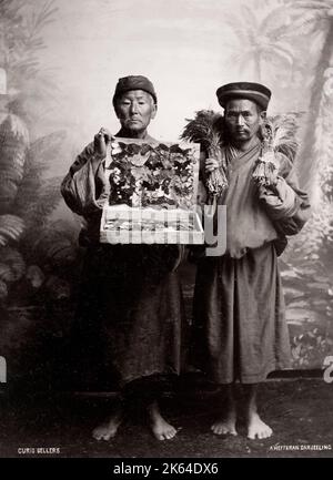 Vintage 19th century photograph: curio sellers, probably Tibetan, photographed in northern Inida. Stock Photo