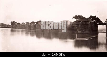 John Thomson (14 June 1837 - 29 September 1921)  Scottish photographer, active in China c.1870, from an album of his images: bridge  Chao-chow-fu Chaozhou, over the River Han. Stock Photo