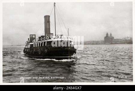 Ferry boat crossing the River Mersey to Birkenhead, with Liverpool Docks and Harbour in the back ground with the distinctive shape of the Liver Building - Merseyside, England Stock Photo