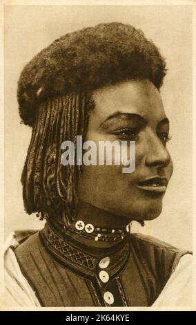 Beautiful East African Woman with braided and afro hair, prepared in an interesting style. Stock Photo