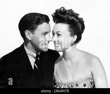 George Murphy, Ginny Simms, on-set of the Film, 'Broadway Rhythm', MGM, 1944 Stock Photo