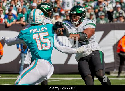 New York Jets guard Alijah Vera-Tucker (75) looks on during an NFL  pre-season football game against the New York Giants, Aug. 27, 2022, in  East Rutherford, N.J. Vera-Tucker had an impressive rookie