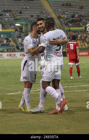 St. Petersburg, FL: Tampa Bay Rowdies defender Santi Castaneda (24) is congratulated by defender Jordan Scarlett (5) and forward Sebastián Guenzatti ( Stock Photo