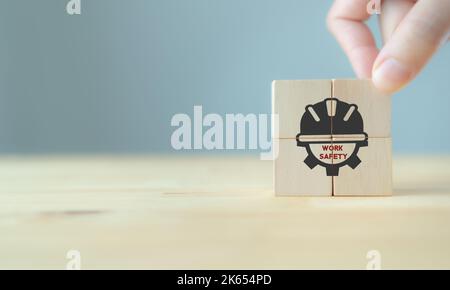 Work safety concept. Safety at workplace, safety first, hazards, protections, health, regulations  and group insurance.  Working standard process. Zer Stock Photo