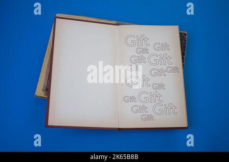 Gift word in opened book with vintage, natural patterns old antique ...