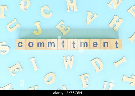 Commitment core values concept in business, company and organization. Word typography on wooden blocks flat lay. Stock Photo