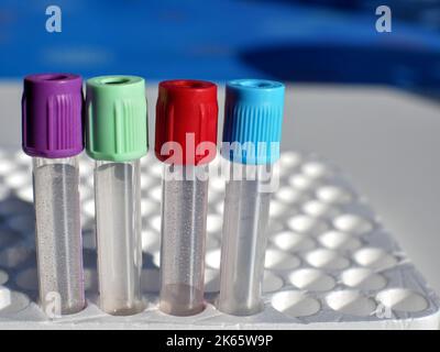 Blood collection tubes with colored stoppers, on a polystyrene support Stock Photo