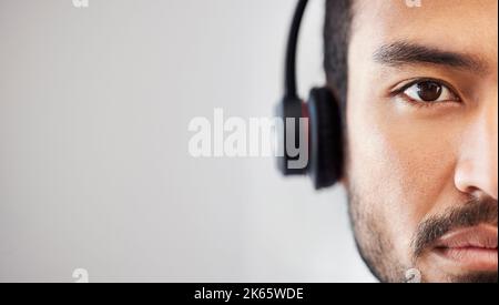 Closeup face of young man listening to music. Portrait of man listening to music through headphones. Multiethnic man listening to music using Stock Photo