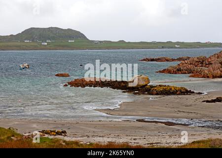 A view over the Sound of Iona to the Isle of Iona in the Inner Hebrides from the coast of Mull at Fionnphort, Isle of Mull, Scotland. Stock Photo