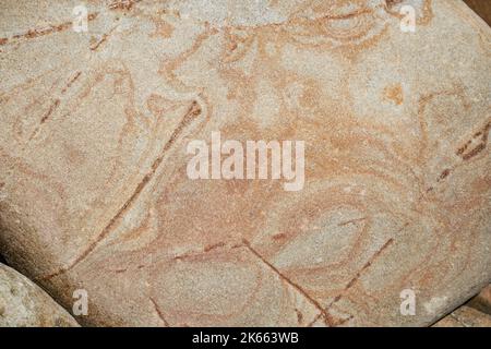 Beach stone texture from Santa Barbara California. Natural beige and orange high quality background Stock Photo