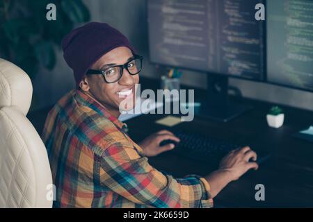 Profile photo of cheerful front end developer sitting chair keyboard typing operating server indoors Stock Photo