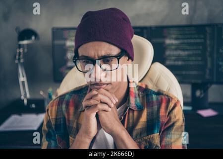 Photo of minded intelligent guy sitting chair hands touch chin brainstorming contemplate office indoors Stock Photo
