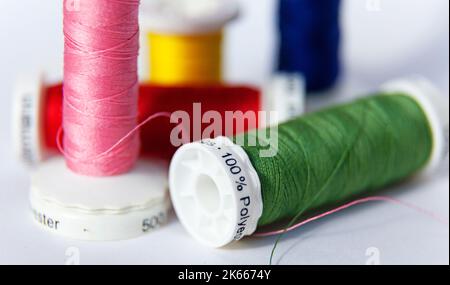 sewing thread in different colors and 100 percent polyester Stock Photo
