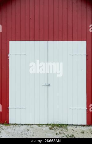 Red door and exterior clapboard wall - stock photo Stock Photo