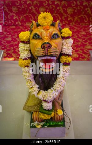 Lion, the vahan of Maa Durga being worshipped at a temple in Mumbai for the auspicious Indian festival of Navratri Stock Photo