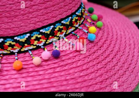 decoration on bright pink straw hat Stock Photo