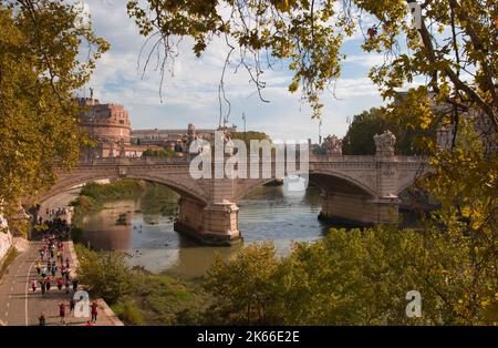 ROME, ITALY - OCTOBER 9, 2022: View of Ponte Sant Angelo (Saint Angel Bridge) and Castel Sant Angelo with autumn foliage. Tourist attractions of Rome Stock Photo