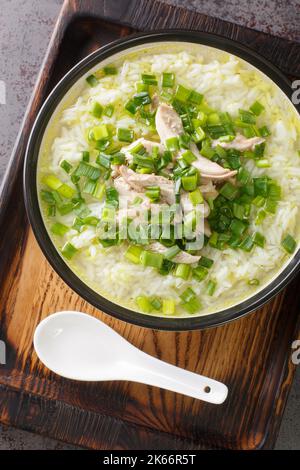 Dak Gomtang Korean Chicken Soup close-up in a bowl on the table. Vertical top view from above Stock Photo