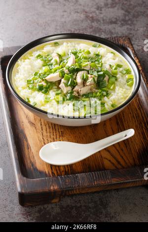 Dak Gomtang Korean Chicken Soup close-up in a bowl on the table. Vertical Stock Photo