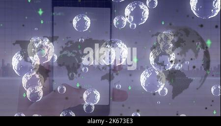 Image of world map, globe and bubbles over hand holding smartphone ...
