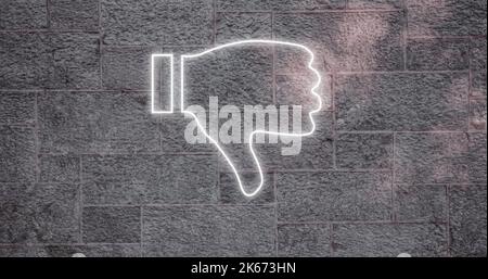 Composite of illuminated digital white dislike button icon against gray wall, copy space Stock Photo