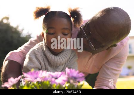 African american father and daughter spending time together in the garden Stock Photo