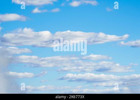 White clouds float in the backdrop blue sky. Zimbabwe, Africa Stock Photo